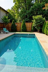 Clean lines, tan coping, fenced backyard pool, swimming, new
