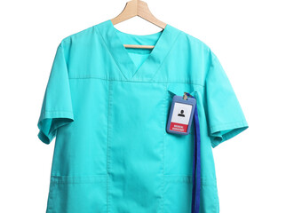 Medical worker uniform with badge on hanger against white background
