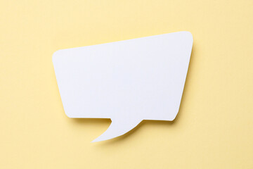 Blank speech bubble on beige background. Space for text