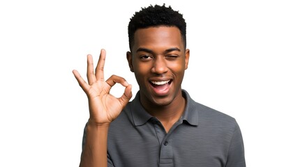 Fototapeta premium A smiling man with dark hair winking and making an ok hand gesture against a white background