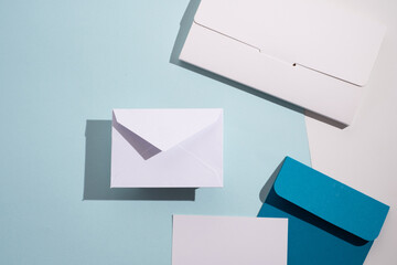 Paper envelopes on a light background. New mail, write a message. Send and receive mail. Postal...