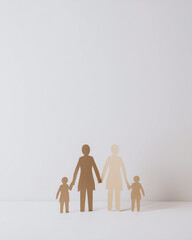 Paper chain dolls holding hands representing family unity  