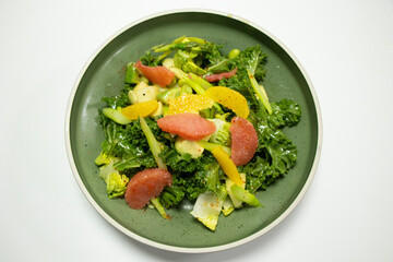 healthy kale asparagus with orange grapefruit and edamame beans salad with white background