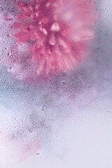 Smoke Soft focus flower bouquet through glass with water drops. Abstract natural blur pink, violet,...