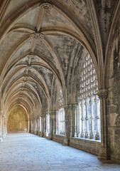 Intricate stone arches and columns in the beautiful cloister at Batalha monastery