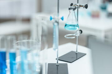 Chemical laboratory glassware with blue liquid samples in test tubes, scientific research experiment, biotechnology innovation, pharmaceutical analysis development, medical diagnostics