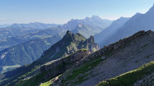 Flight over arete towards mountain panorama with summit Pointe de Savolaires in Swiss Alps, Switzerland