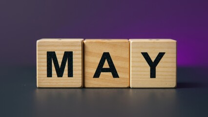 Wooden Cubes Spelling "MAY"