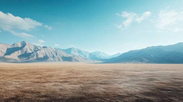 A wide-angle ground with a clear sky and mountainous background for vehicles or products placement. Copy space image. Place for adding text or design