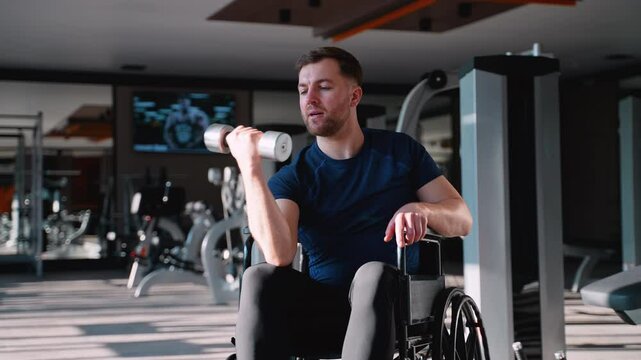 Man in wheelchair doing bicep curl exercise