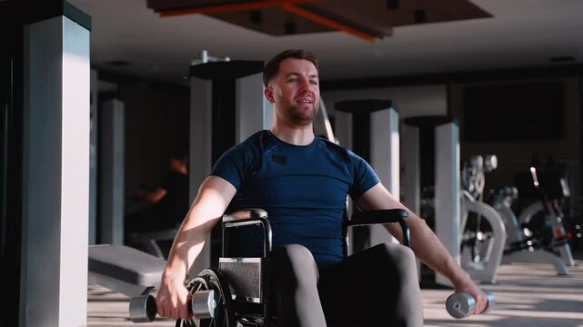 Man in wheelchair doing dumbbell lateral raises at gym