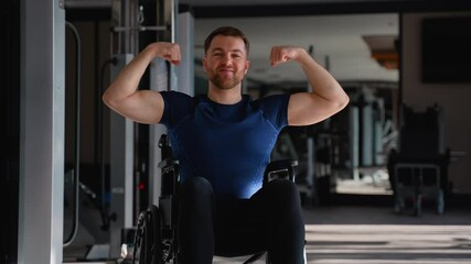 Strong man in a wheelchair poses and flexes his arms after workout, symbolizing strength, confidence, and adaptive fitness motivation