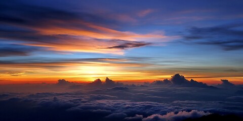 Sunrise above clouds, mountain range. Aerial view. Possible use Stock photo for nature, travel, or inspirational projects