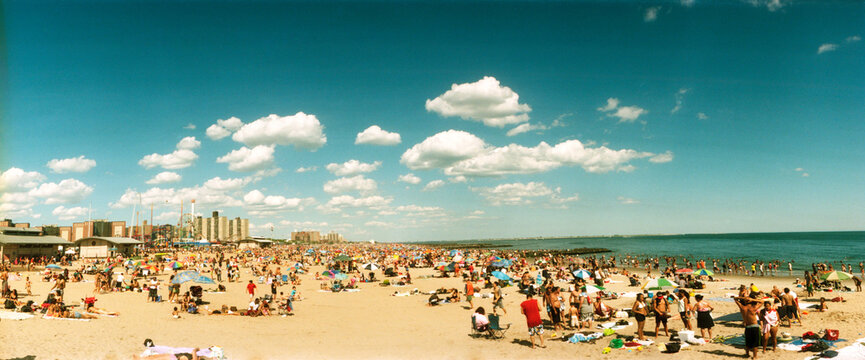 Panoramic view of tourists on the beach at Coney Island, Brooklyn, New York City, New York State, USA.