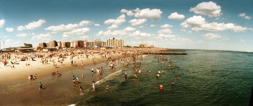 Panoramic view of tourists enjoying on the beach at Coney Island, Brooklyn, New York City, New York State, USA.
