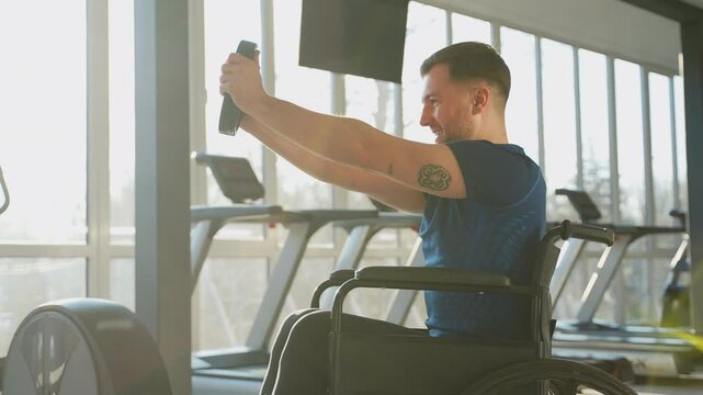 Man in wheelchair training at gym