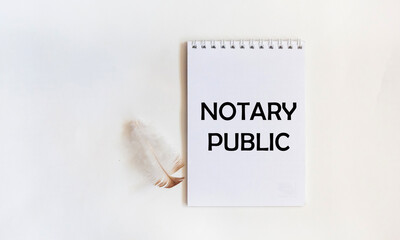 A notebook with the text NOTARY PUBLIC on a white background