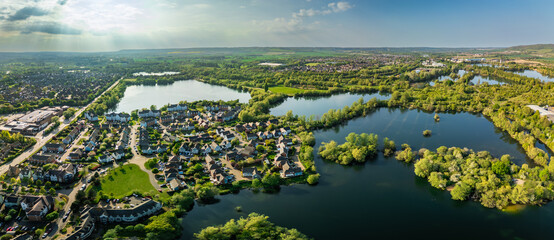 Aerial drone view of .Leybourne Lakes and housing estate, Aylesford, Kent, England