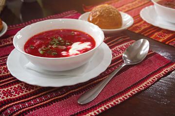 White bowl of traditional Ukranian soup borsch or vegetable beetroot soup. Food