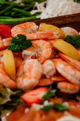 royal shrimps, Shrimp close-up in a large pile.Smoked and salted shrimp with spices for a beer snack, Royal shrimp in batter with lemon and salad