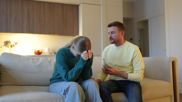 Enraged devastated woman accuses guilty defensive husband trying to justify himself. Deception, emotional outburst, deep resentment, marriage turmoil, heated discussion, infidelity, shattered love