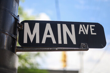 Main AVE street sign in a city © Mason