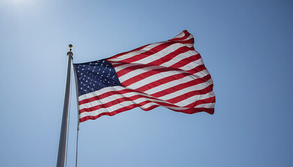 American flag waving proudly against a clear blue sky symbolizing freedom