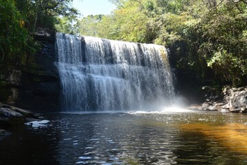 Fototapeta premium Vibrant Rainbow at Waterfall Base in Tropical Gran Sabana Landscape