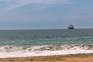 Golden Sandy Beach with Blue Ocean and Boat in Manzanillo, Colima, Mexico