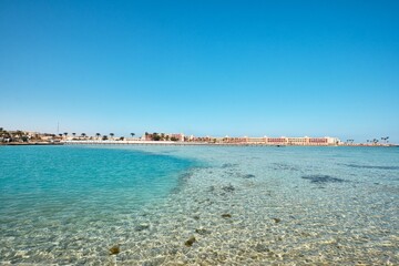 Hurghada, Egypt - January 03, 2024: Crystal clear water of Red Sea in front of a Bel Air Azur Resort Hotel