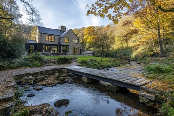 Wooden Footbridge Over Tranquil Autumn Stream in Sunlit Forest