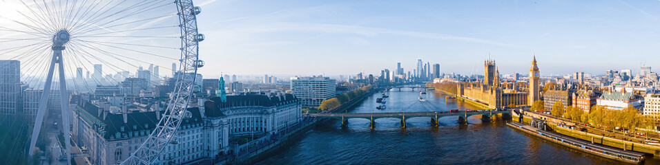 Fototapeta premium Iconic London skyline with London Eye in morning light over the Thames