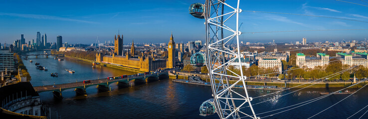 Iconic London skyline with London Eye in morning light over the Thames