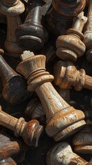 A pile of old, weathered wooden chess pieces