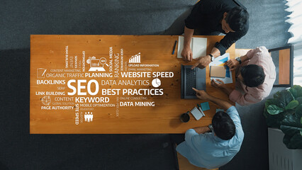 A team collaborates on effective SEO strategies, emphasizing keyword research, data analytics, and...