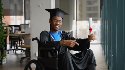 Proud graduate in wheelchair with diploma