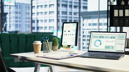 Empty luxurious corporate high end office designed for a CEO or leader, running analytics and data driven insights on screen. Urban global enterprise, business empowerment. Camera A.