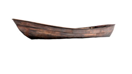 Isolated weathered wooden rowboat against a stark black backdrop creating a sense of solitude