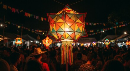 A vibrant, geometric lantern illuminates a lively, crowded night festival, adorned with colorful bunting, creating a festive atmosphere.