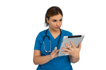 Medical professional reviewing digital data on tablet, highlighting healthcare technology with focused professional demeanor