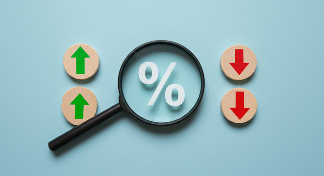 Entrepreneurship, startup, corporate a magnifying glass over a percentage sign with up and down arrows on a light blue background view from above