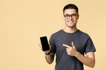 Blogger insists at better offer for customers. Happy handsome young guy in brown t-shirt and...