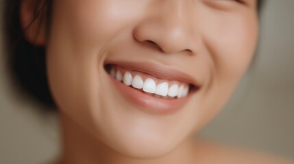 Obraz premium Smiling woman with radiant teeth enjoying a moment of joy indoors during daylight hours.