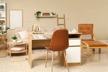 Interior of stylish living room with workplace, sofa and armchair