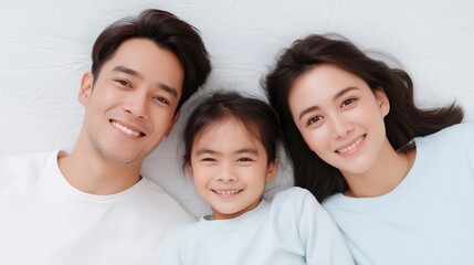 Fototapeta premium Family enjoying a joyful moment together indoors with smiles and warmth during a cozy afternoon.