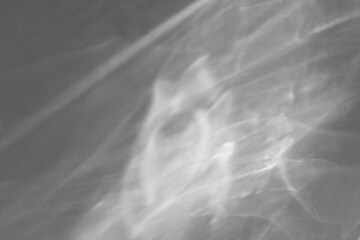 Caustic effect light refraction on white wall overlay photo mockup, blurred sun rays refracting...