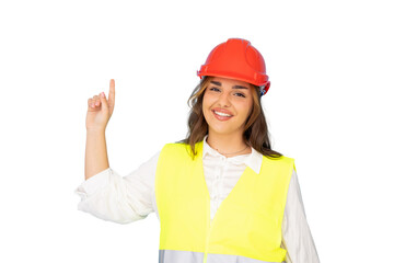 Professional female architect pointing upward, wearing safety vest and hardhat, standing against transparent background
