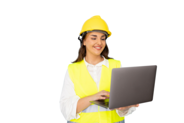 Professional female architect wearing hard hat, analyzing blueprints on laptop near construction site plans