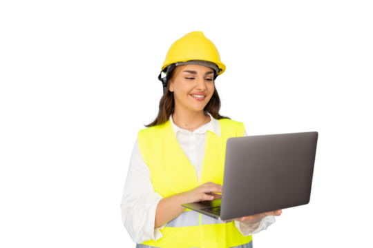 Professional female architect wearing hard hat, analyzing blueprints on laptop near construction site plans