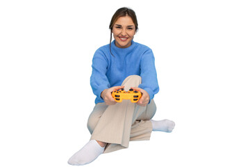 Happy young woman sitting with crossed legs holding a controller playing videogames with transparent background © PeopleVideos